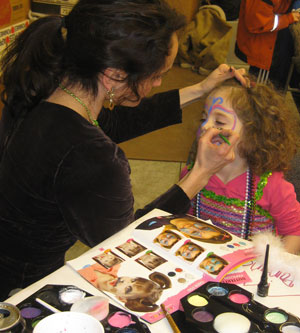 Face painting at a girls birthday party